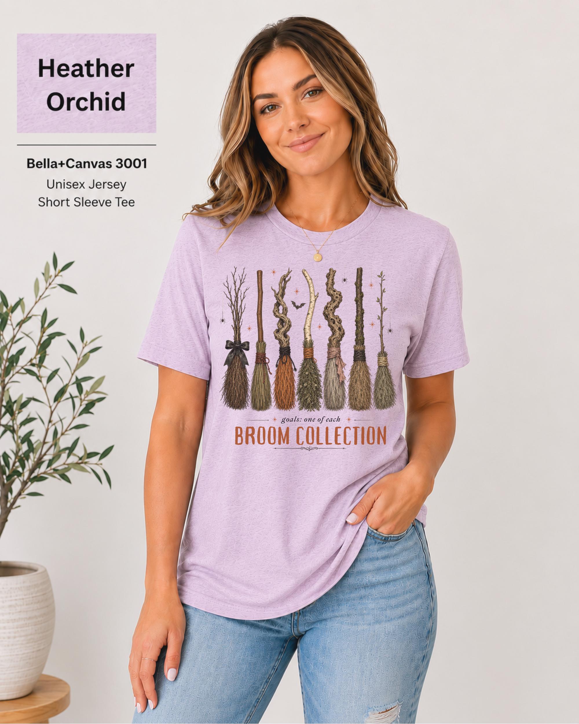 Bella+Canvas 3001 Heather Orchid unisex t-shirt featuring a vintage Broom Collection graphic with illustrated witch brooms, earthy autumn colors, and cozy Halloween-inspired artwork.