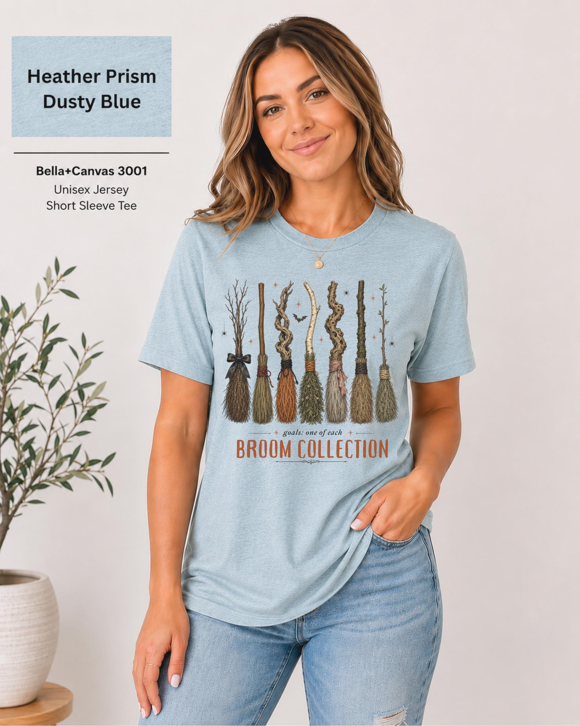 Bella+Canvas 3001 Heather Prism Dusty Blue unisex t-shirt featuring a vintage Broom Collection graphic with illustrated witch brooms, earthy autumn colors, and cozy Halloween-inspired artwork.