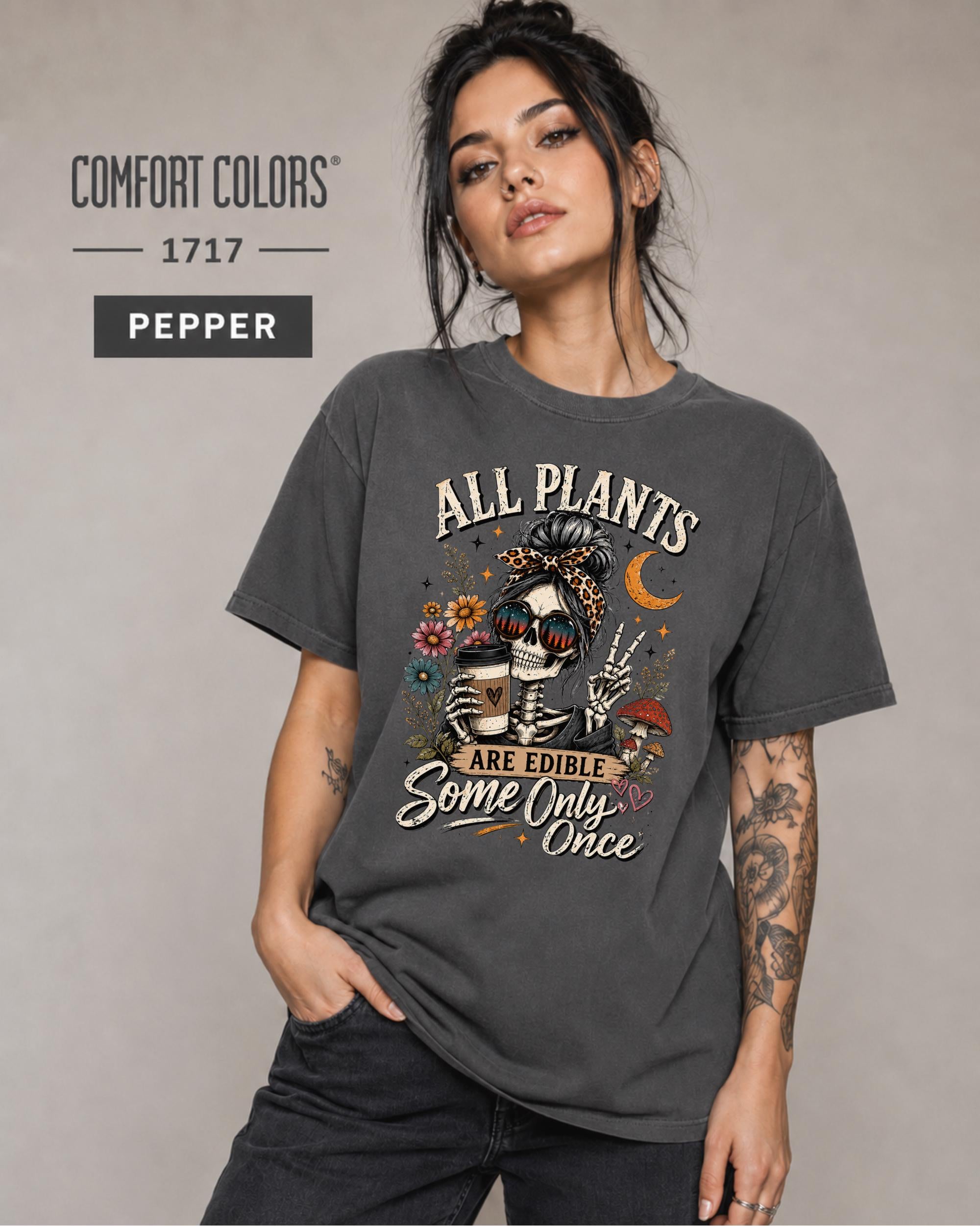 Comfort Colors 1717 Pepper unisex t-shirt featuring a vintage skeleton holding coffee with the funny quote "All Plants Are Edible, Some Only Once," surrounded by flowers, mushrooms, and spooky botanical artwork.
