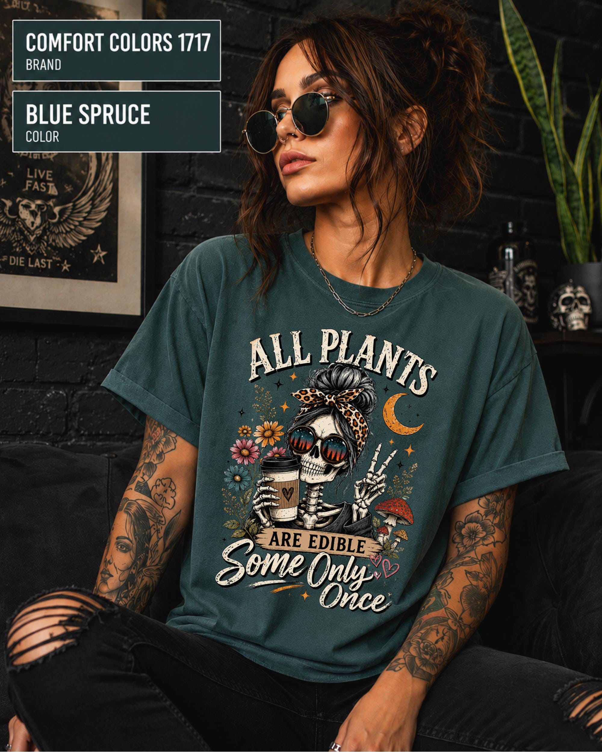 Comfort Colors 1717 Blue Spruce unisex t-shirt featuring a vintage skeleton holding coffee with the funny quote "All Plants Are Edible, Some Only Once," surrounded by flowers, mushrooms, and spooky botanical artwork.