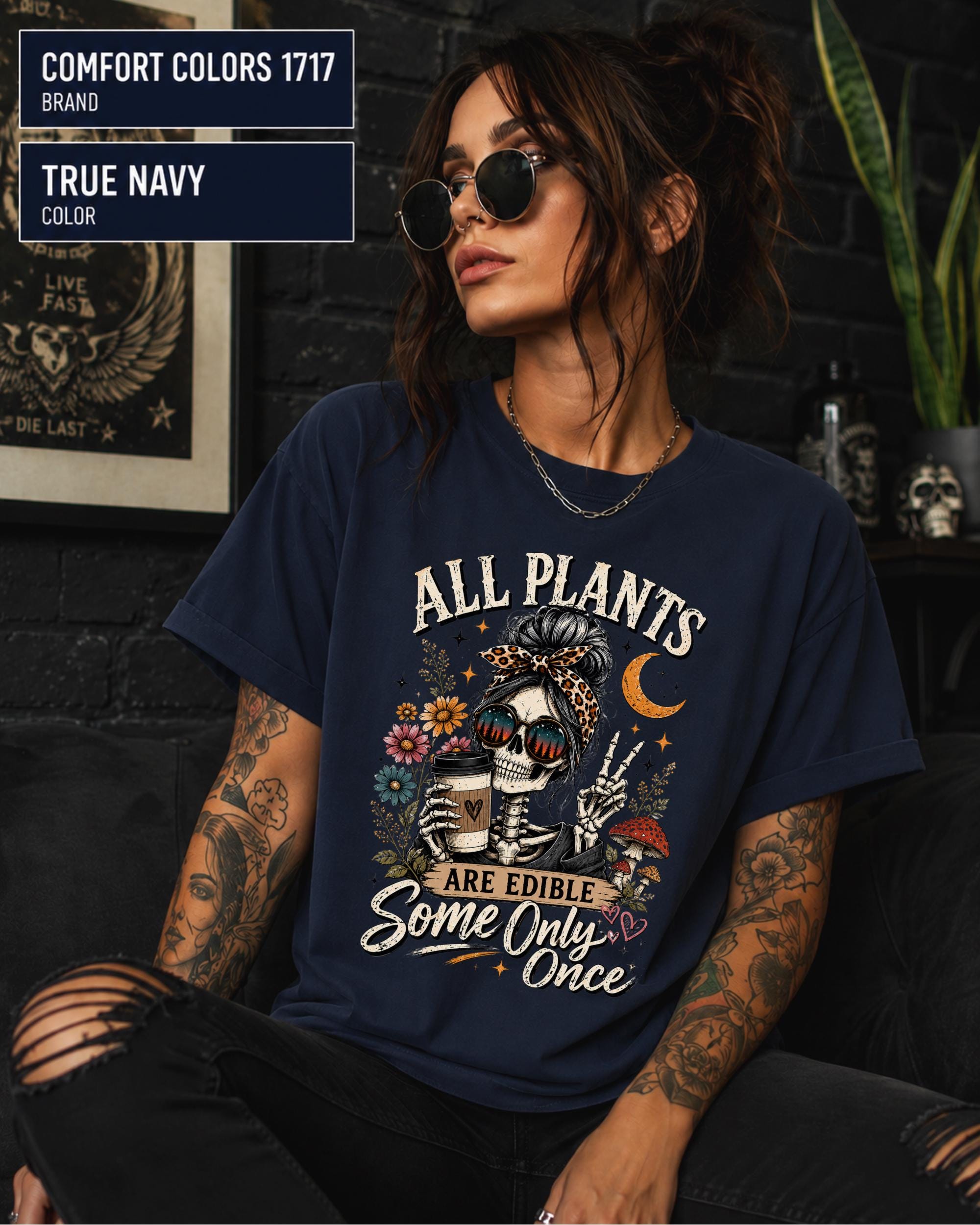 Comfort Colors 1717 True Navy unisex t-shirt featuring a vintage skeleton holding coffee with the funny quote "All Plants Are Edible, Some Only Once," surrounded by flowers, mushrooms, and spooky botanical artwork.
