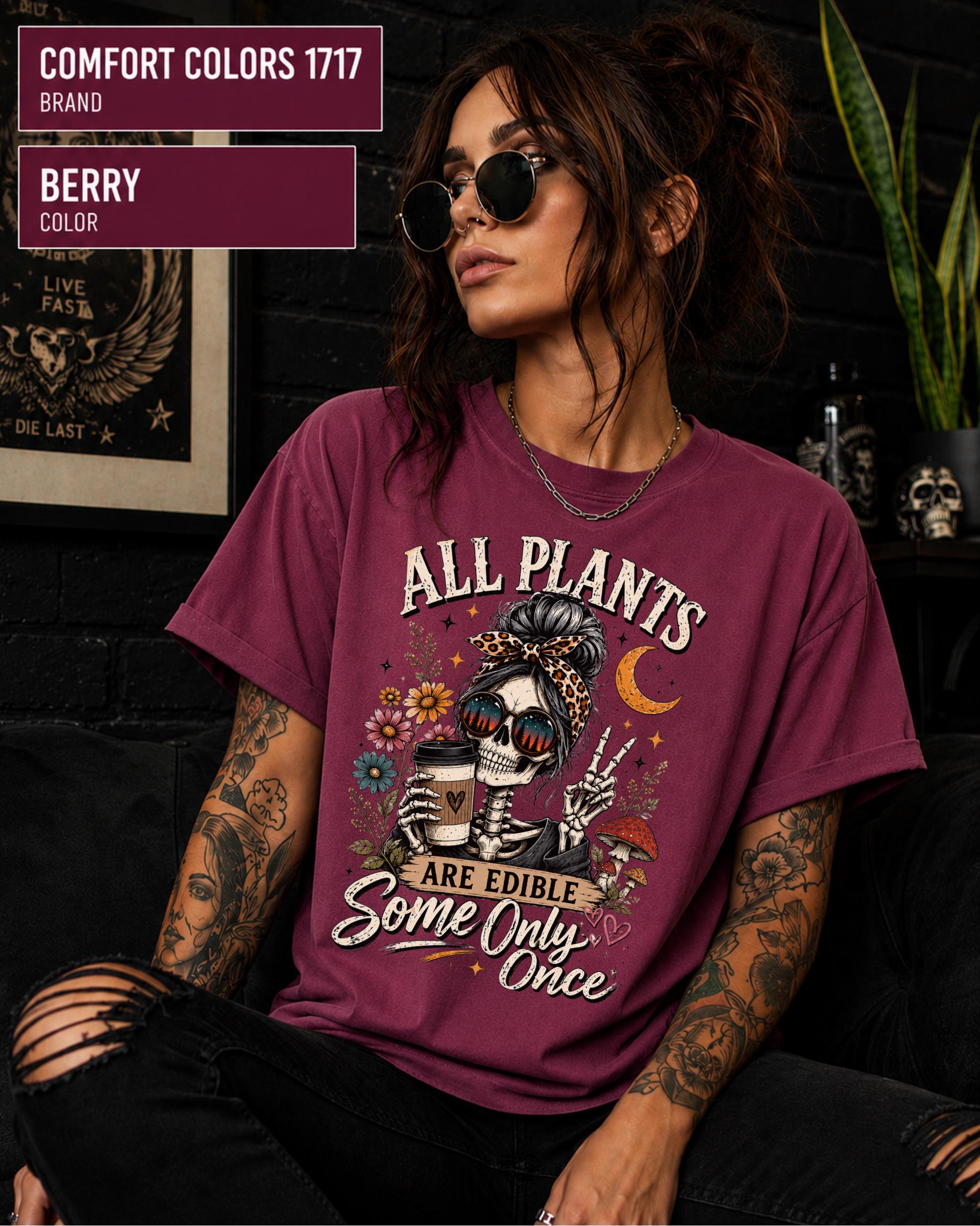 Comfort Colors 1717 Berry unisex t-shirt featuring a vintage skeleton holding coffee with the funny quote "All Plants Are Edible, Some Only Once," surrounded by flowers, mushrooms, and spooky botanical artwork.