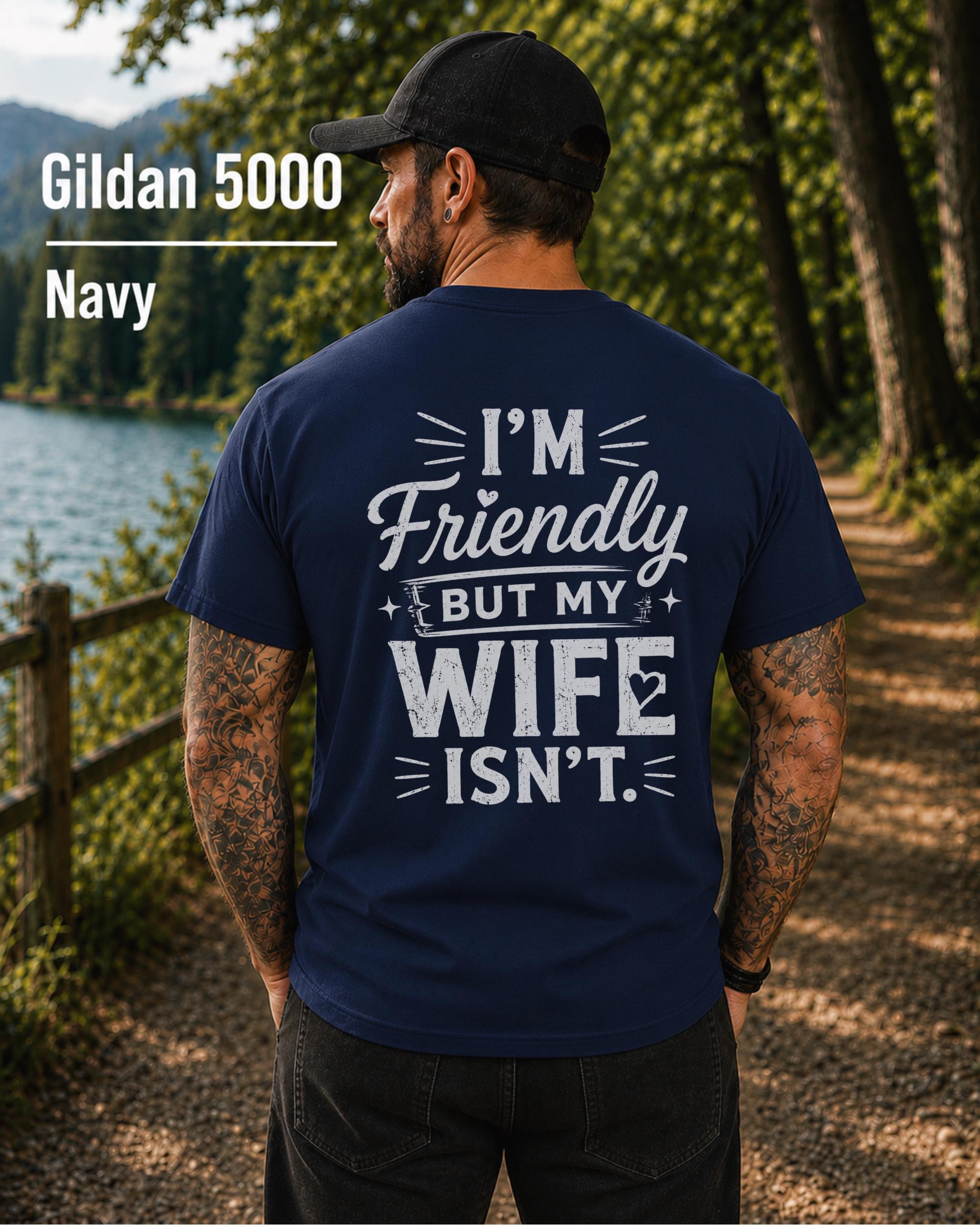 Funny husband t-shirt with "I'm Friendly But My Wife Isn't" back print on a navy Gildan 5000 unisex tee, humorous men's graphic shirt for husbands, dads, and Father's Day gifts.
