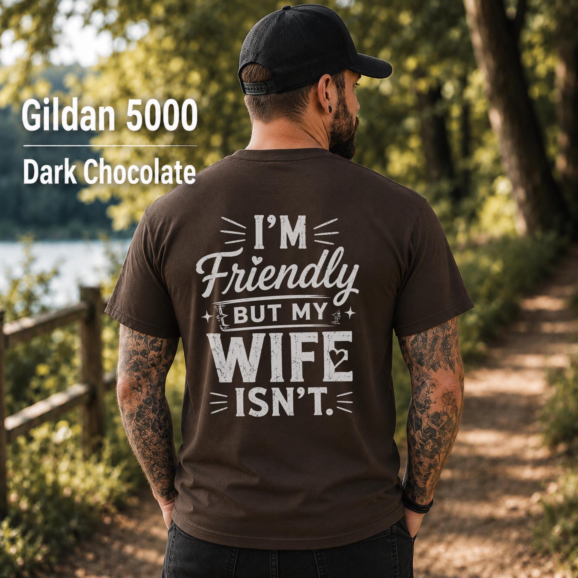 Funny husband t-shirt with "I'm Friendly But My Wife Isn't" back print on a Dark Chocolate Gildan 5000 unisex tee, humorous men's graphic shirt for husbands, dads, and Father's Day gifts.