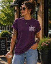 Blackberry Gildan 5000 unisex t-shirt with a small left chest graphic reading "Proud Wife of a Husband Who Has Great Taste and Questionable Friends," funny couple apparel.