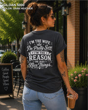 Women's funny wife t-shirt featuring "I'm the Wife, I'm Pretty Sure I'm the Reason He Has Nice Things" back graphic on a Dark Heather Gildan 5000 tee, humorous marriage shirt for wives.