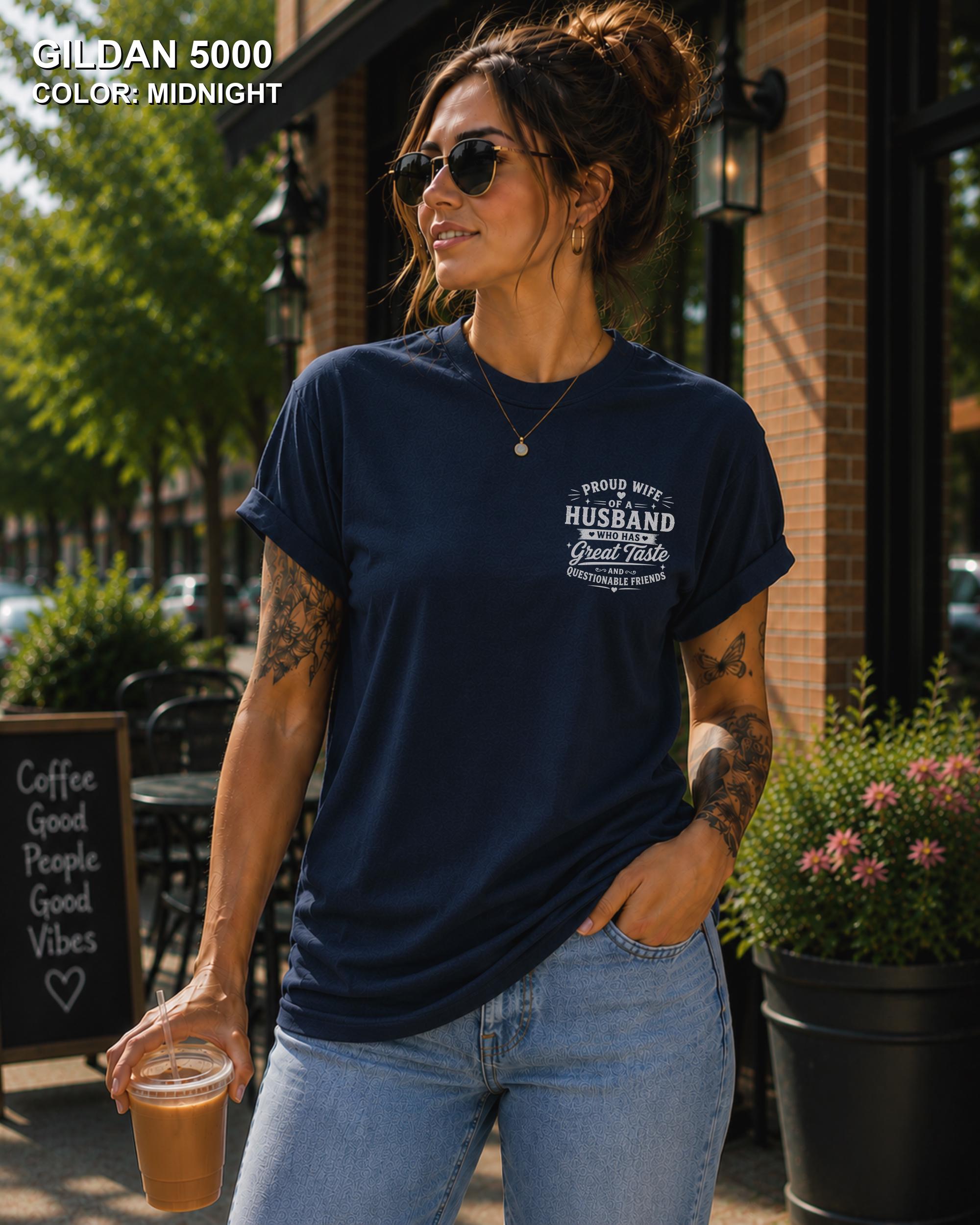 Midnight Gildan 5000 unisex t-shirt with a small left chest graphic reading "Proud Wife of a Husband Who Has Great Taste and Questionable Friends," funny couple apparel.