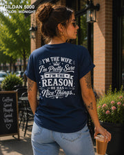 Women's funny wife t-shirt featuring "I'm the Wife, I'm Pretty Sure I'm the Reason He Has Nice Things" back graphic on a Midnight Gildan 5000 tee, humorous marriage shirt for wives.