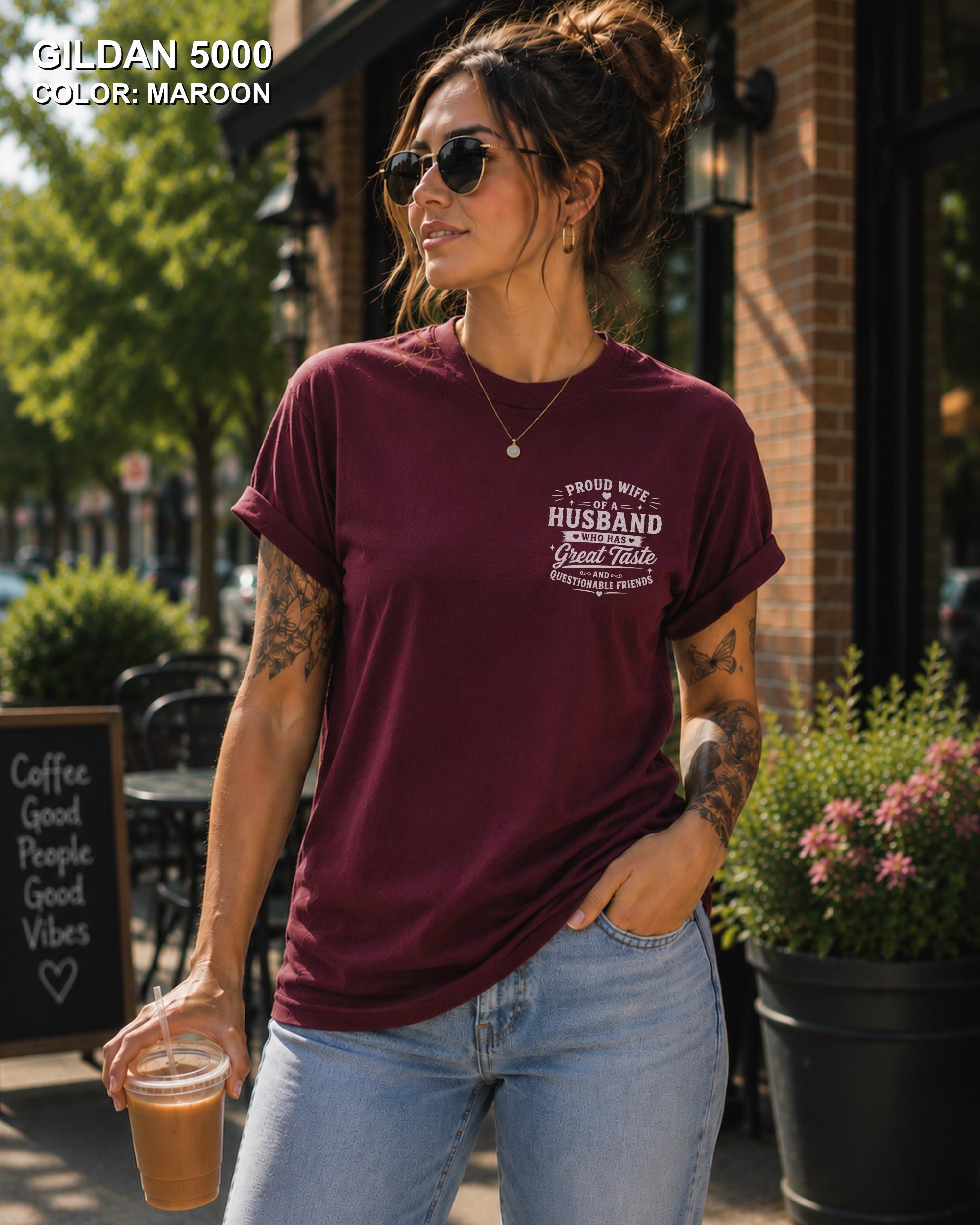 Maroon Gildan 5000 unisex t-shirt with a small left chest graphic reading "Proud Wife of a Husband Who Has Great Taste and Questionable Friends," funny couple apparel.
