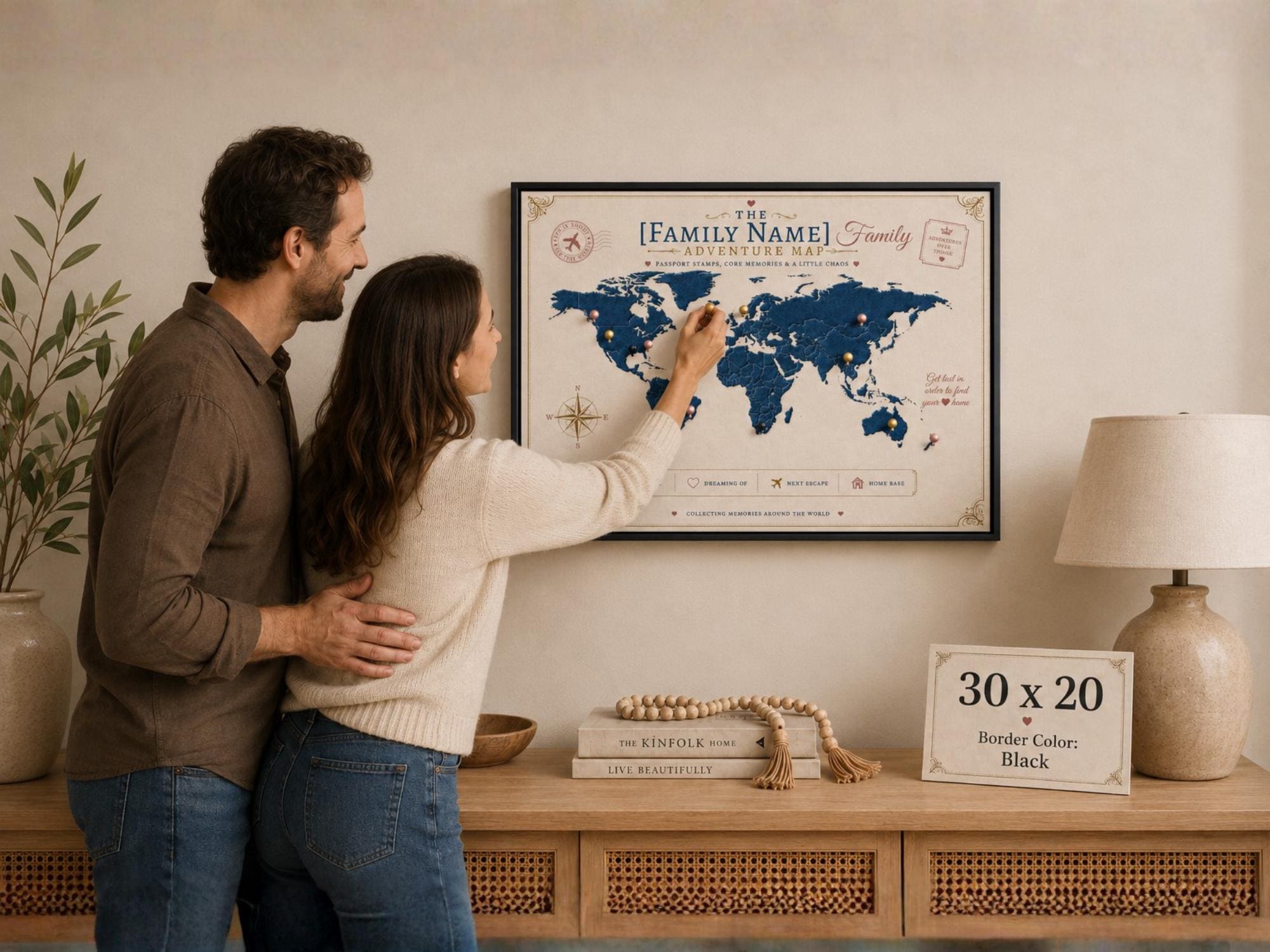 Happy couple placing a thumbtack on a personalized family adventure map canvas with black border, showing how to mark travel memories and destinations.
