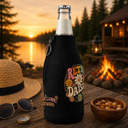 Vintage floral bottle cooler with retro daisy design on insulated beer bottle sleeve.