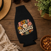Hippie-inspired bottle cooler with colorful daisy artwork and vintage aesthetic.