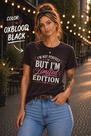 Woman modeling a Oxblood Black Bella+Canvas 3001 unisex t-shirt featuring the "I'm Not Perfect But I'm Limited Edition" graphic in white and pink lettering.