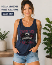 Woman wearing a navy Bella+Canvas 3480 jersey tank featuring a gothic "Pickleball Mahjong Repeat" design with burgundy roses, distressed lettering, crossed paddles, and a heart-detail pickleball.