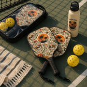 Boho pickleball paddles featuring decorative sugar skull artwork with vibrant flowers and tropical sunset design.
