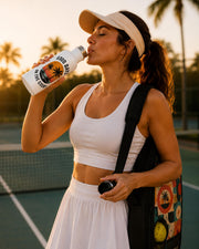 A women drinking from the Good Days on the Court Water Bottle | Pickleball Water Bottle | Tropical Sunset Stainless Steel Bottle | Pickleball Gift | Sports Water Bottle