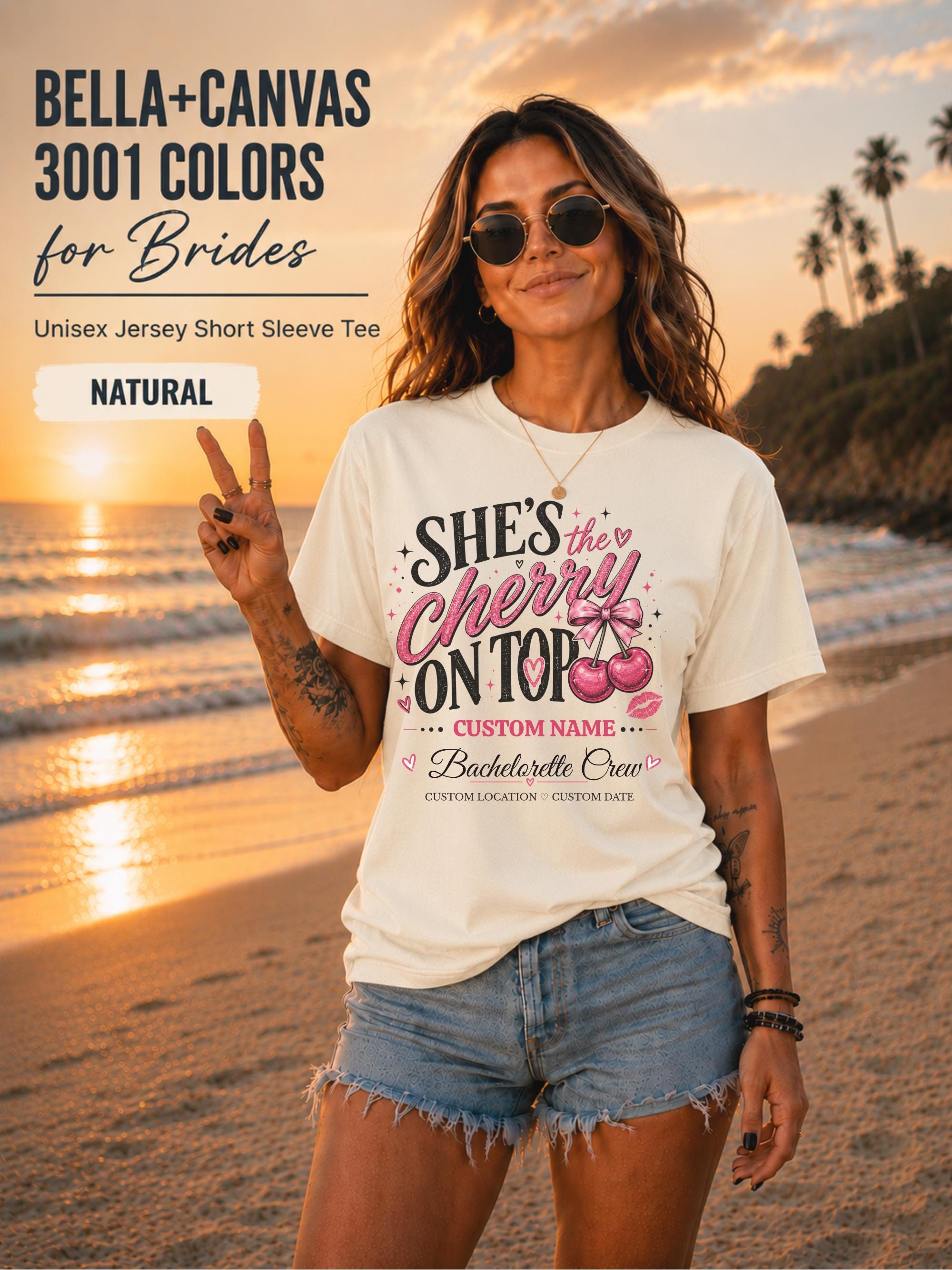 Bella+Canvas 3001 Natural unisex T-shirt featuring a customizable "She's the Cherry on Top" bachelorette crew design with pink cherries, custom name, location, and wedding date for bridal party celebrations.