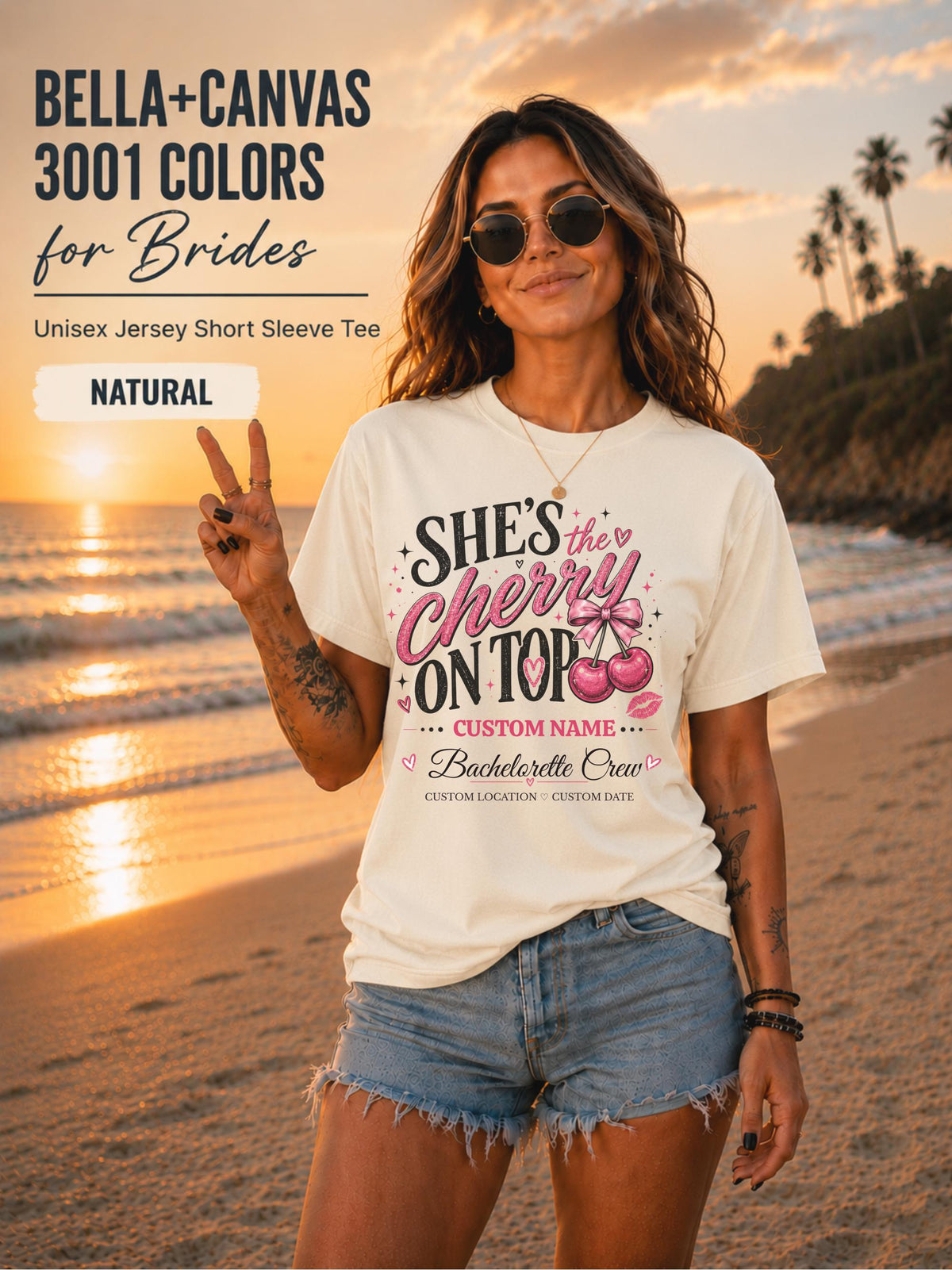 Bella+Canvas 3001 Natural unisex T-shirt featuring a customizable "She's the Cherry on Top" bachelorette crew design with pink cherries, custom name, location, and wedding date for bridal party celebrations.