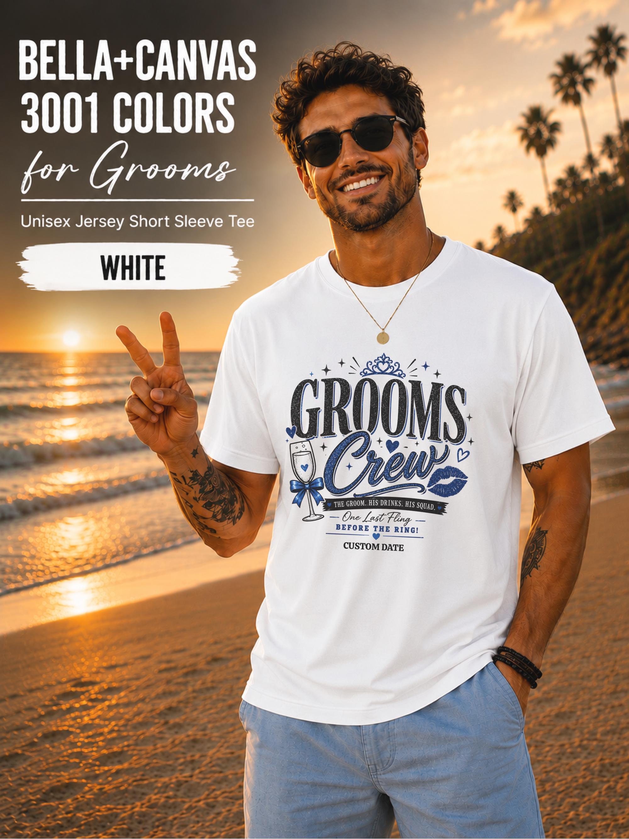 Bella+Canvas 3001 White groom crew shirt featuring a blue wedding party design with champagne glass, crown, kiss mark, and customizable wedding date for bachelor party celebrations.