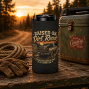Slim can cooler featuring the "Raised on Dirt Roads" vintage pickup truck design on a rustic tailgate with an old cooler and country sunset backdrop, perfect for beer lovers, camping, and country living.