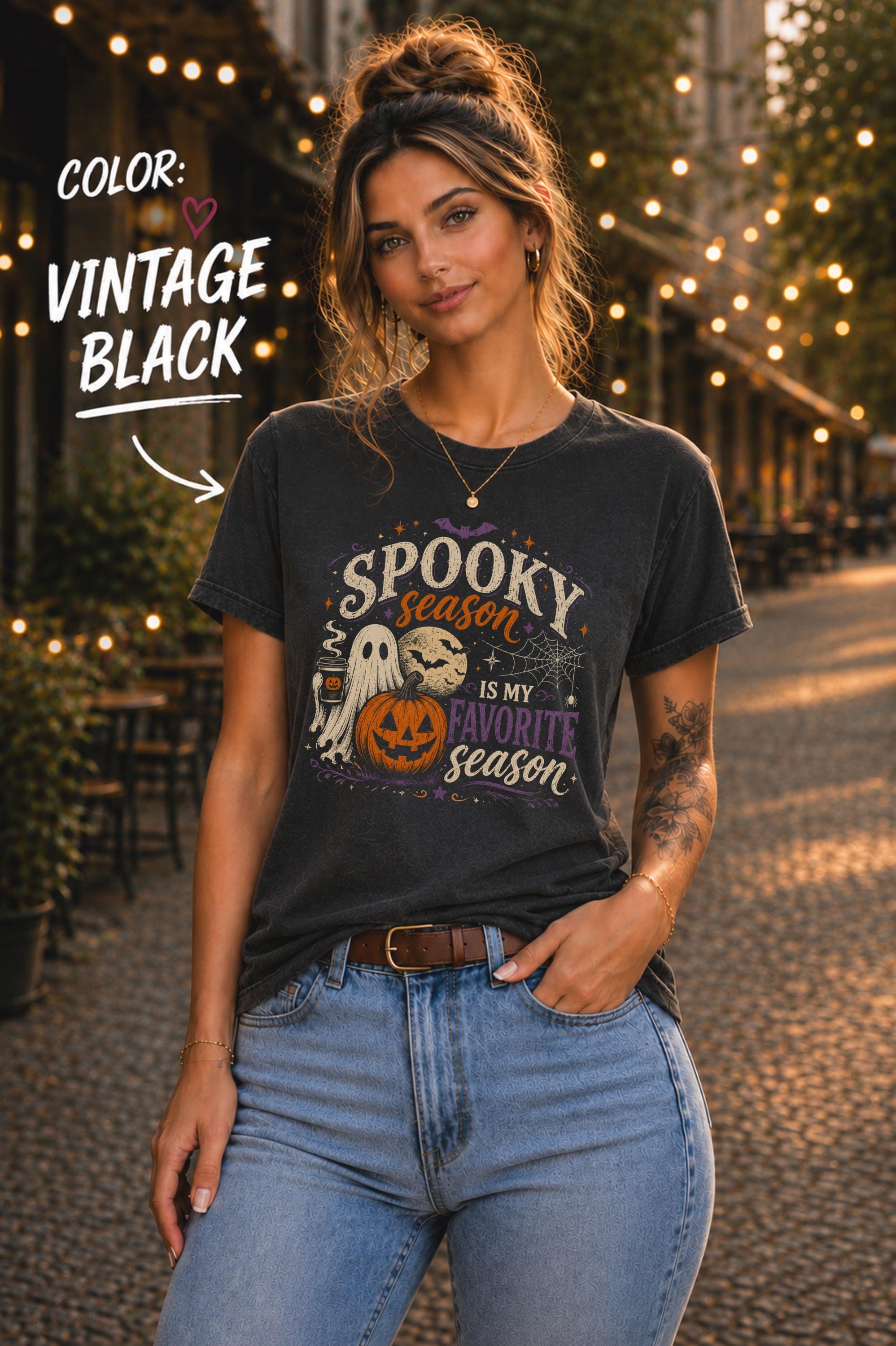 Woman wearing a Bella+Canvas 3001 Vintage Black unisex T-shirt featuring a vintage Halloween design with a cute ghost, pumpkin, spiderweb, full moon, and the phrase "Spooky Season Is My Favorite Season."