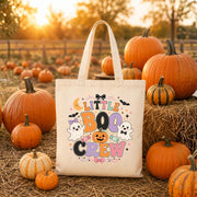 Halloween canvas candy bag mockup with cute ghost, pumpkin, candy, moon, and bat illustration for boys and girls