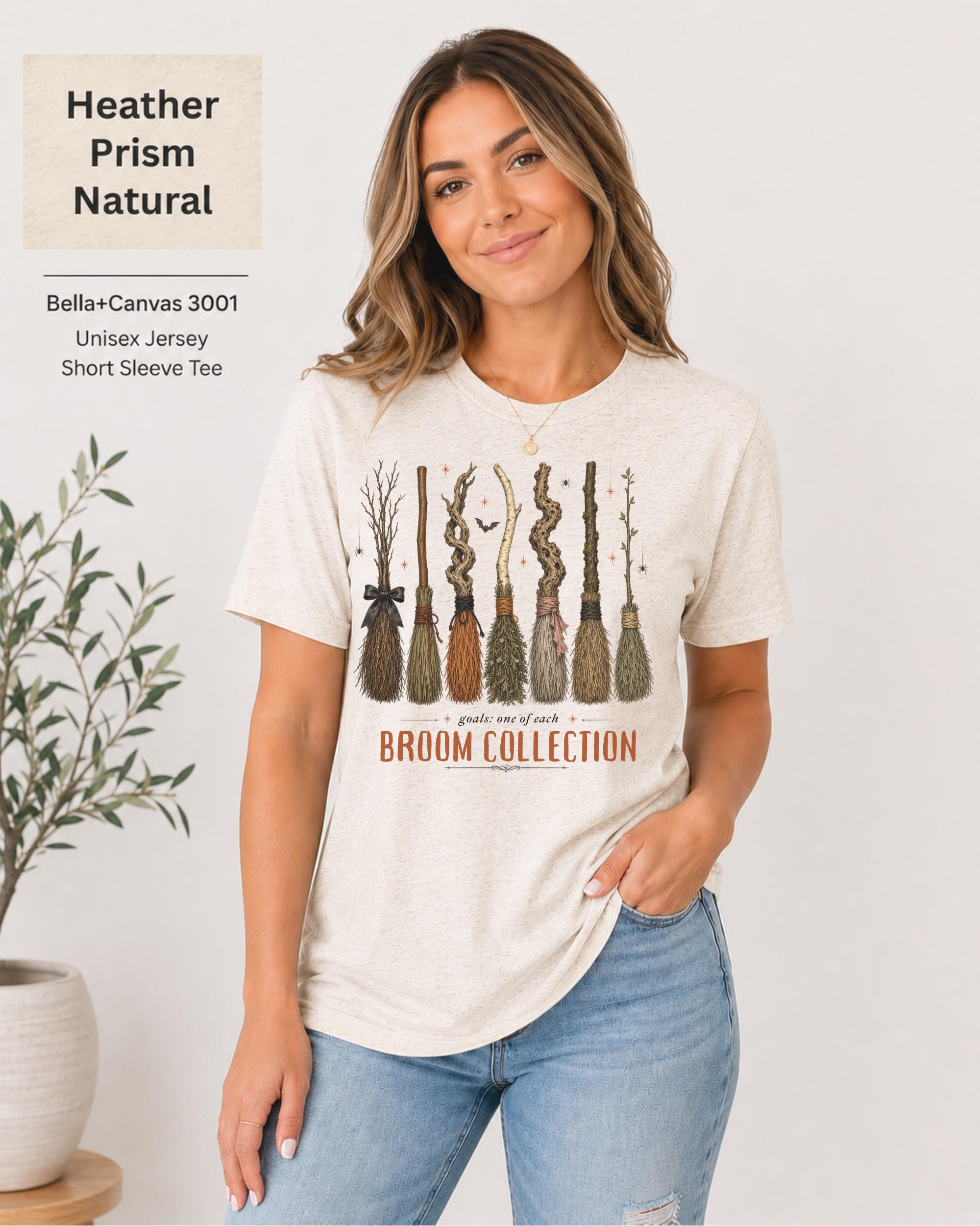Bella+Canvas 3001 Heather Prism Natural unisex t-shirt featuring a vintage Broom Collection graphic with illustrated witch brooms, earthy autumn colors, and cozy Halloween-inspired artwork.
