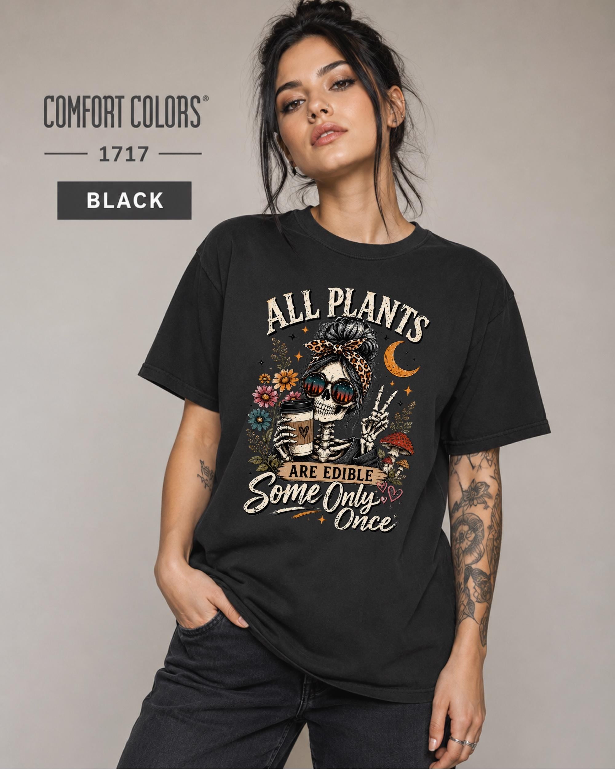 Comfort Colors 1717 Black unisex t-shirt featuring a vintage skeleton holding coffee with the funny quote "All Plants Are Edible, Some Only Once," surrounded by flowers, mushrooms, and spooky botanical artwork.