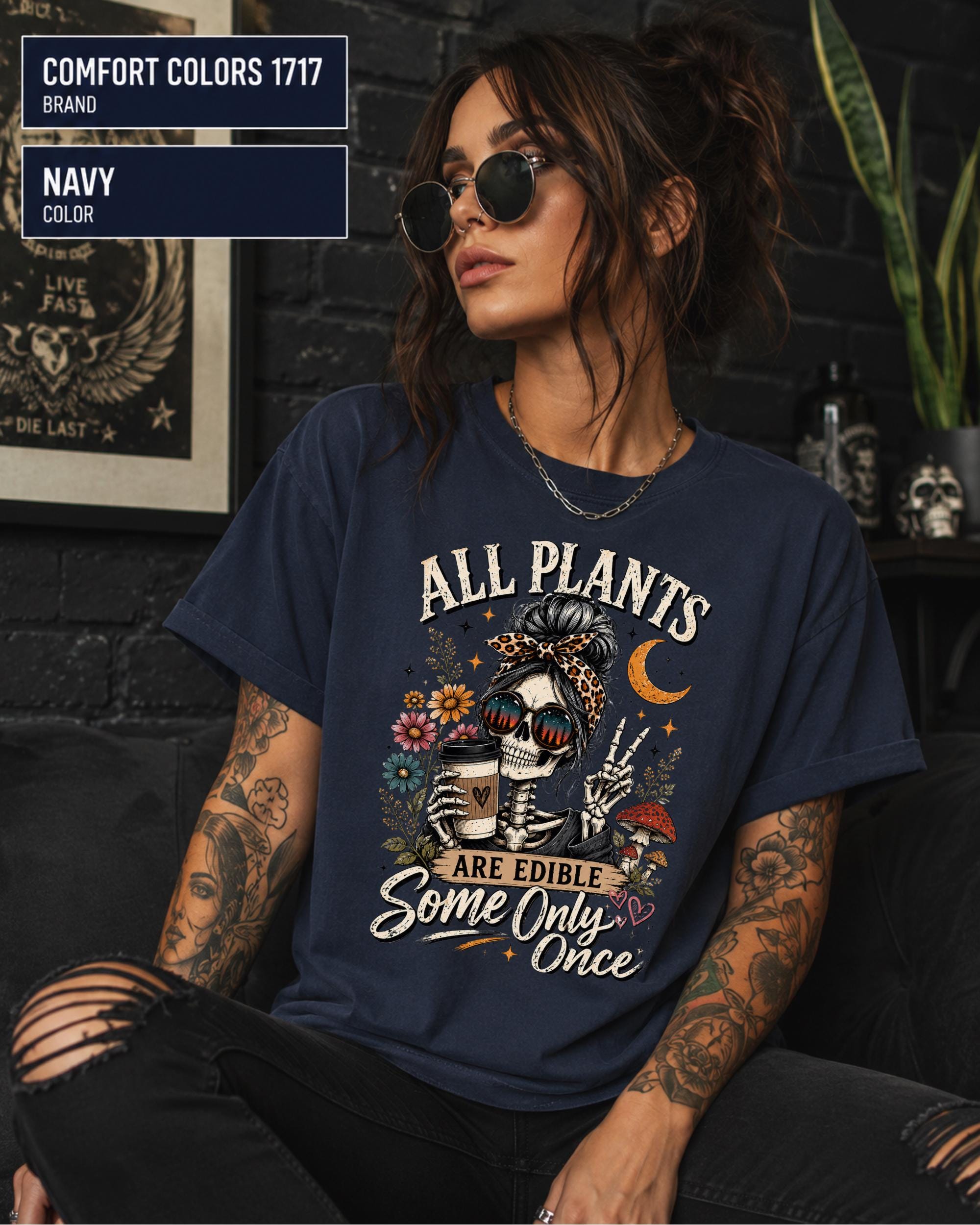 Comfort Colors 1717 Navy unisex t-shirt featuring a vintage skeleton holding coffee with the funny quote "All Plants Are Edible, Some Only Once," surrounded by flowers, mushrooms, and spooky botanical artwork.