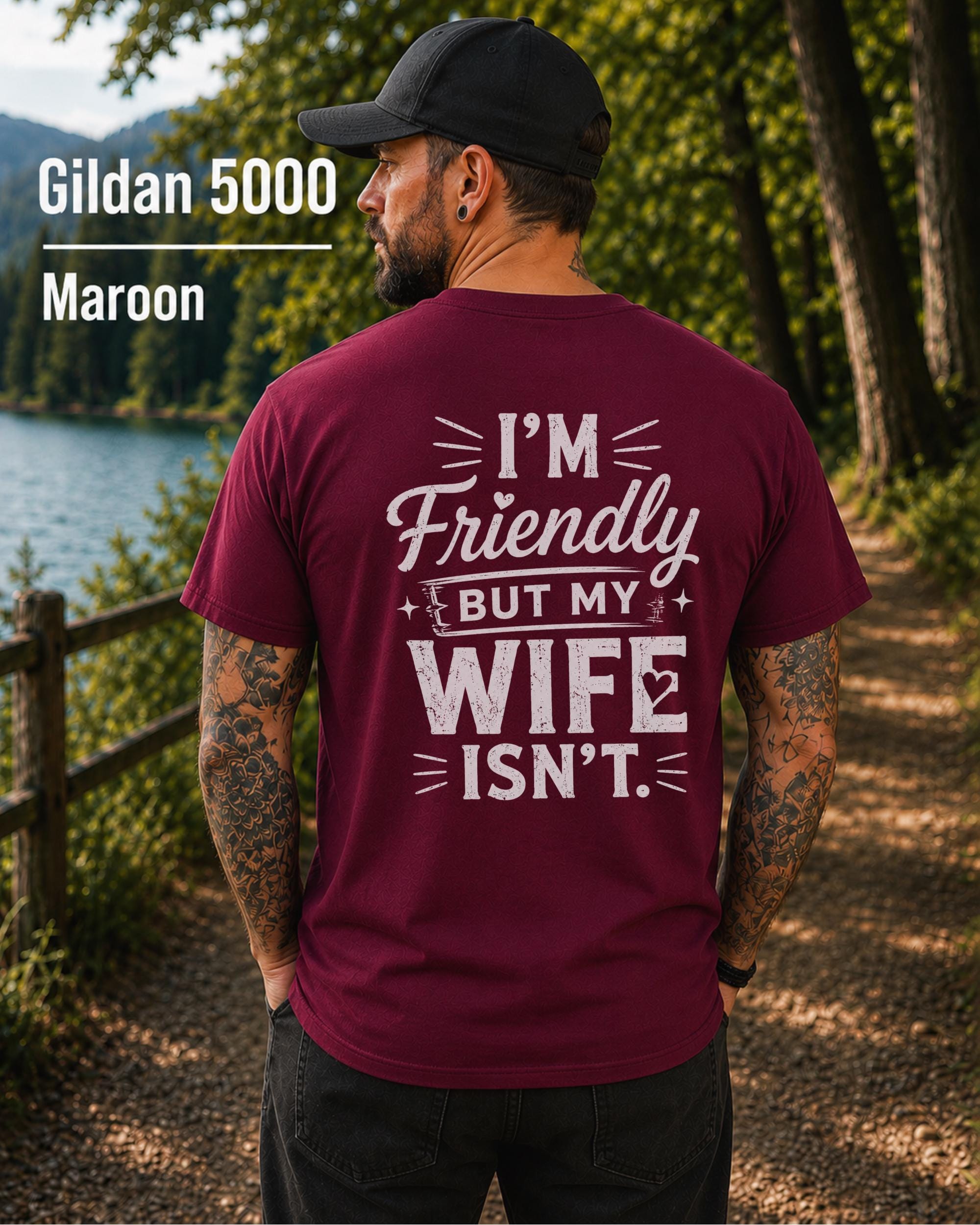 Funny husband t-shirt with "I'm Friendly But My Wife Isn't" back print on a maroon Gildan 5000 unisex tee, humorous men's graphic shirt for husbands, dads, and Father's Day gifts.
