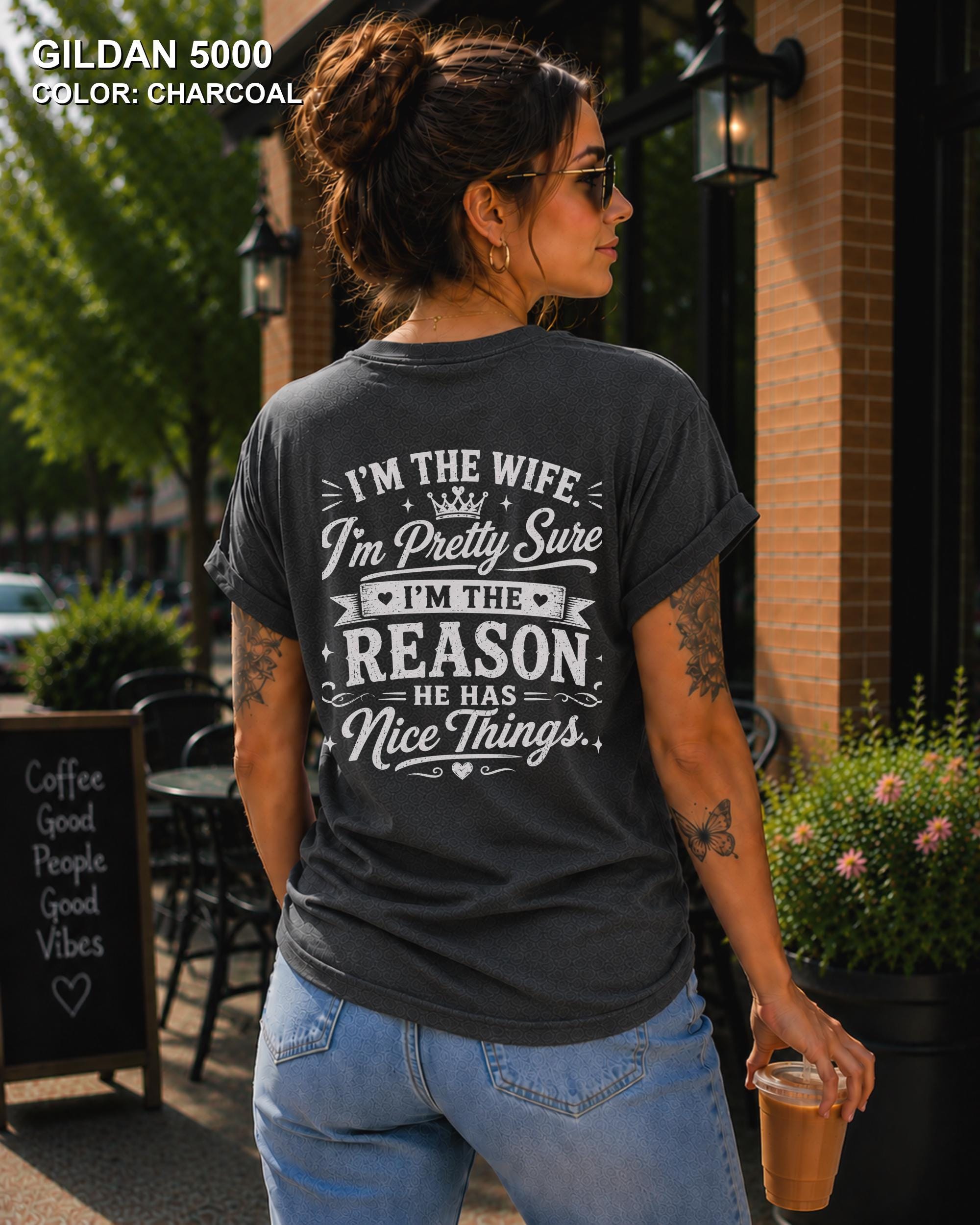 Women's funny wife t-shirt featuring "I'm the Wife, I'm Pretty Sure I'm the Reason He Has Nice Things" back graphic on a charcoal Gildan 5000 tee, humorous marriage shirt for wives.