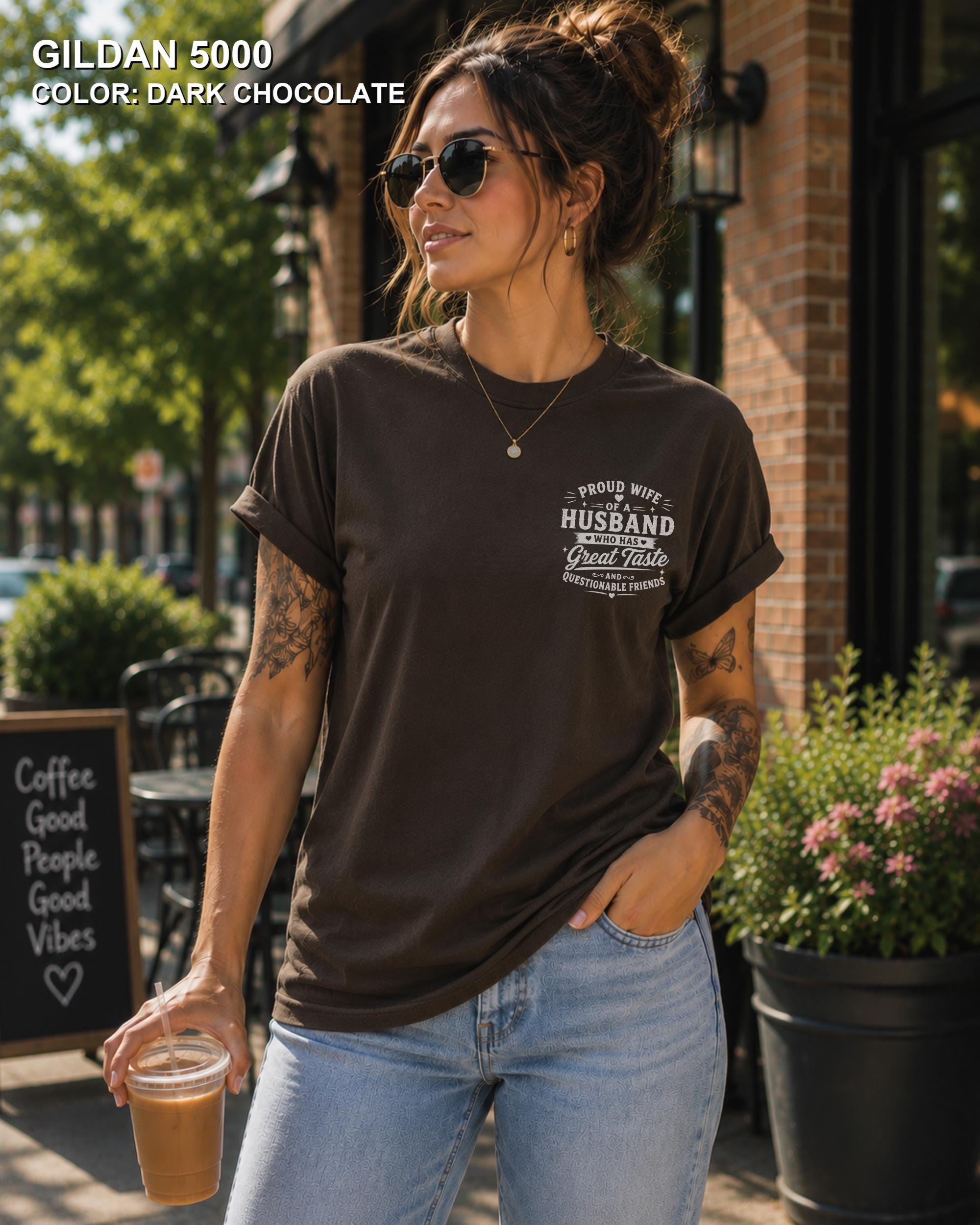Dark Chocolate Gildan 5000 unisex t-shirt with a small left chest graphic reading "Proud Wife of a Husband Who Has Great Taste and Questionable Friends," funny couple apparel.