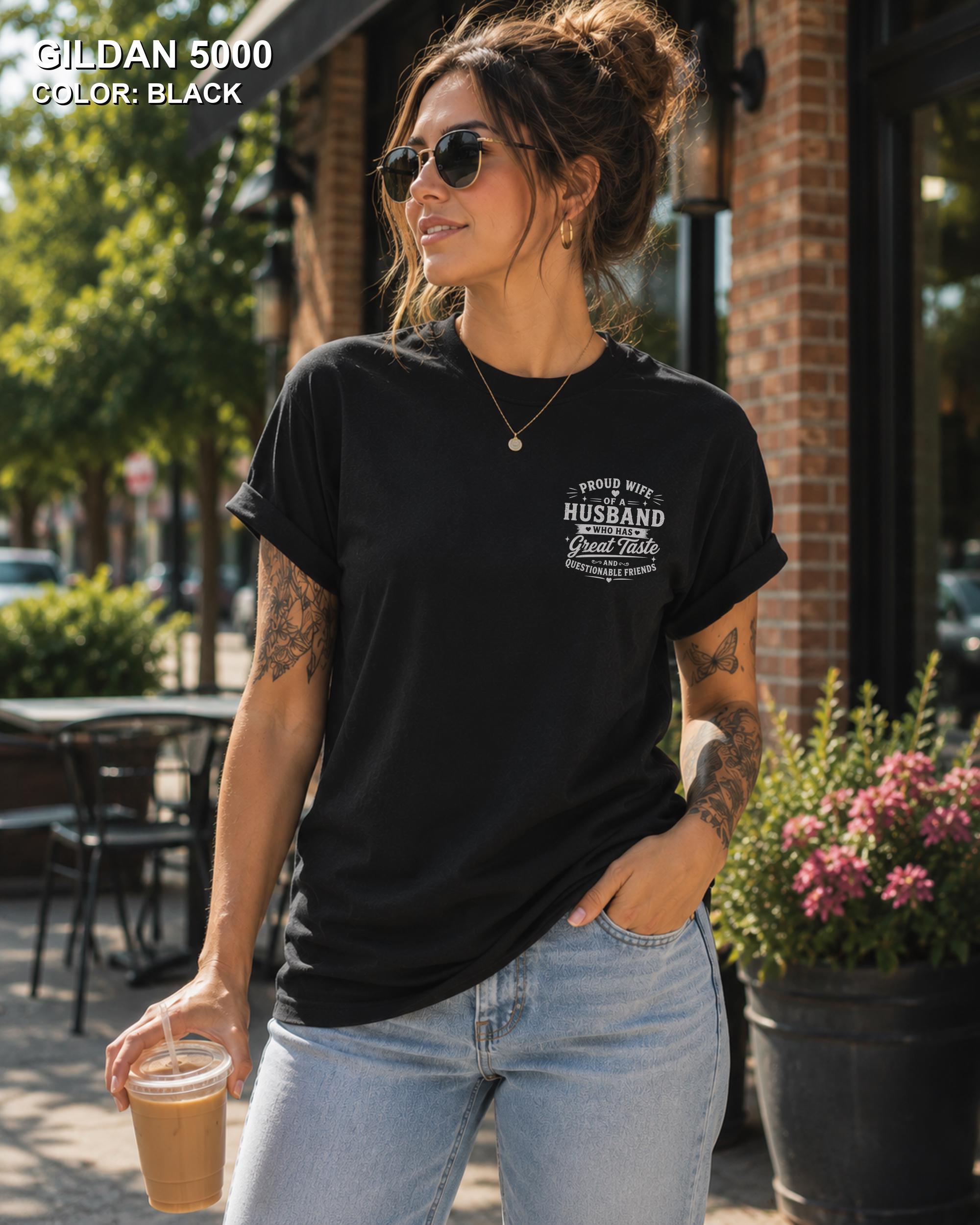 Black Gildan 5000 unisex t-shirt with a small left chest graphic reading "Proud Wife of a Husband Who Has Great Taste and Questionable Friends," funny couple apparel.