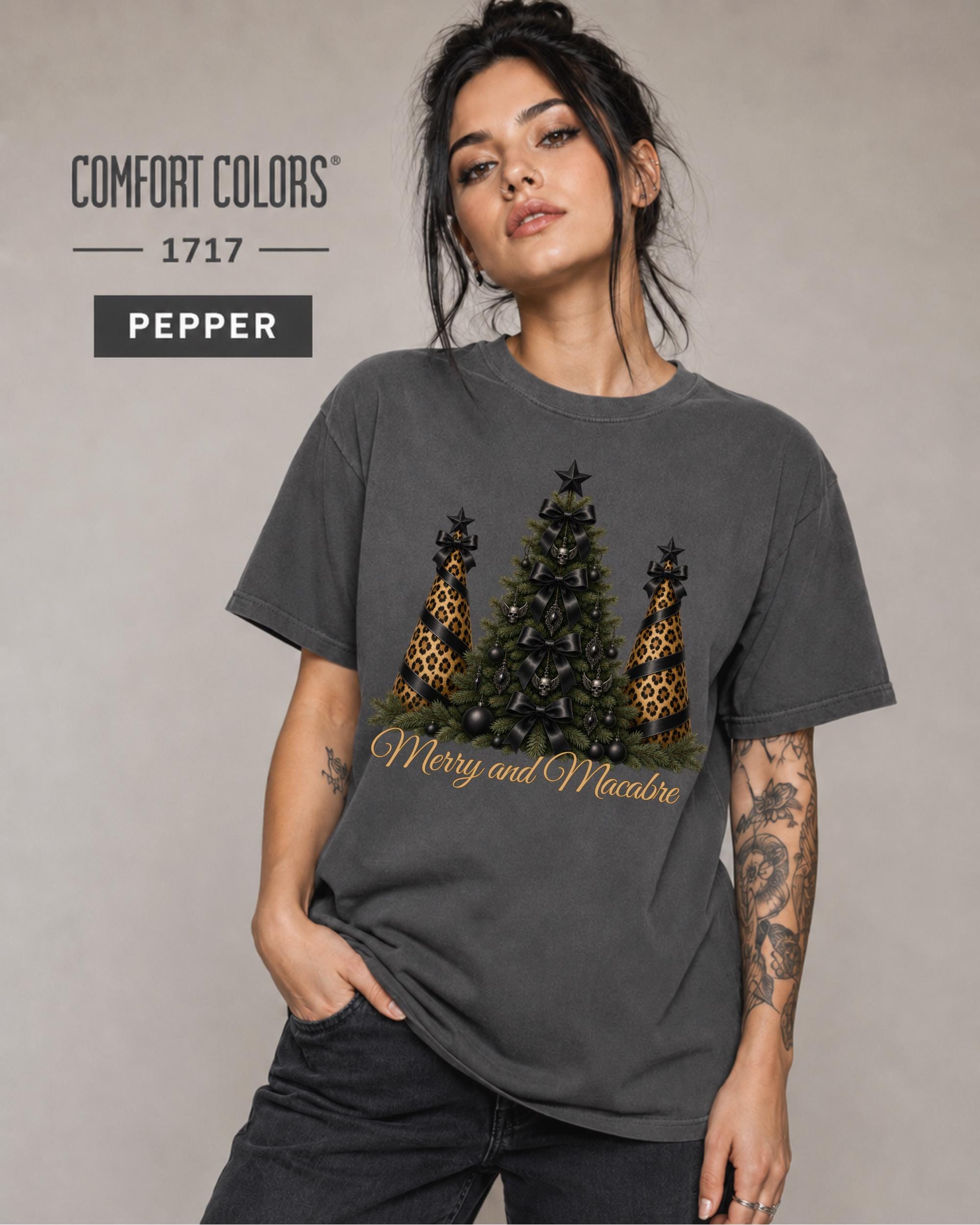 Comfort Colors size and color mockup showing the Merry and Macabre Christmas graphic shirt in Pepper with relaxed unisex fit.