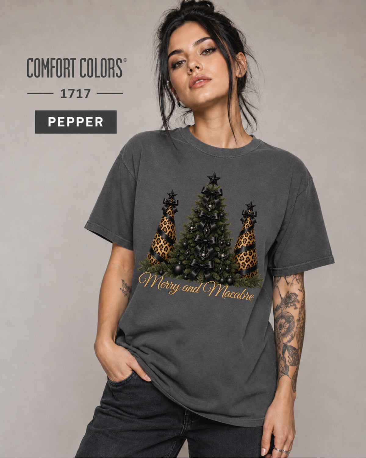 Comfort Colors size and color mockup showing the Merry and Macabre Christmas graphic shirt in Pepper with relaxed unisex fit.