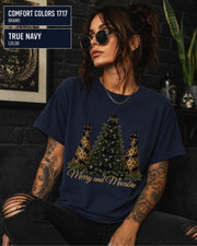 Comfort Colors 1717 True Navy t-shirt featuring a Merry and Macabre gothic Christmas tree design with black bows, skull ornaments, and leopard print trees.