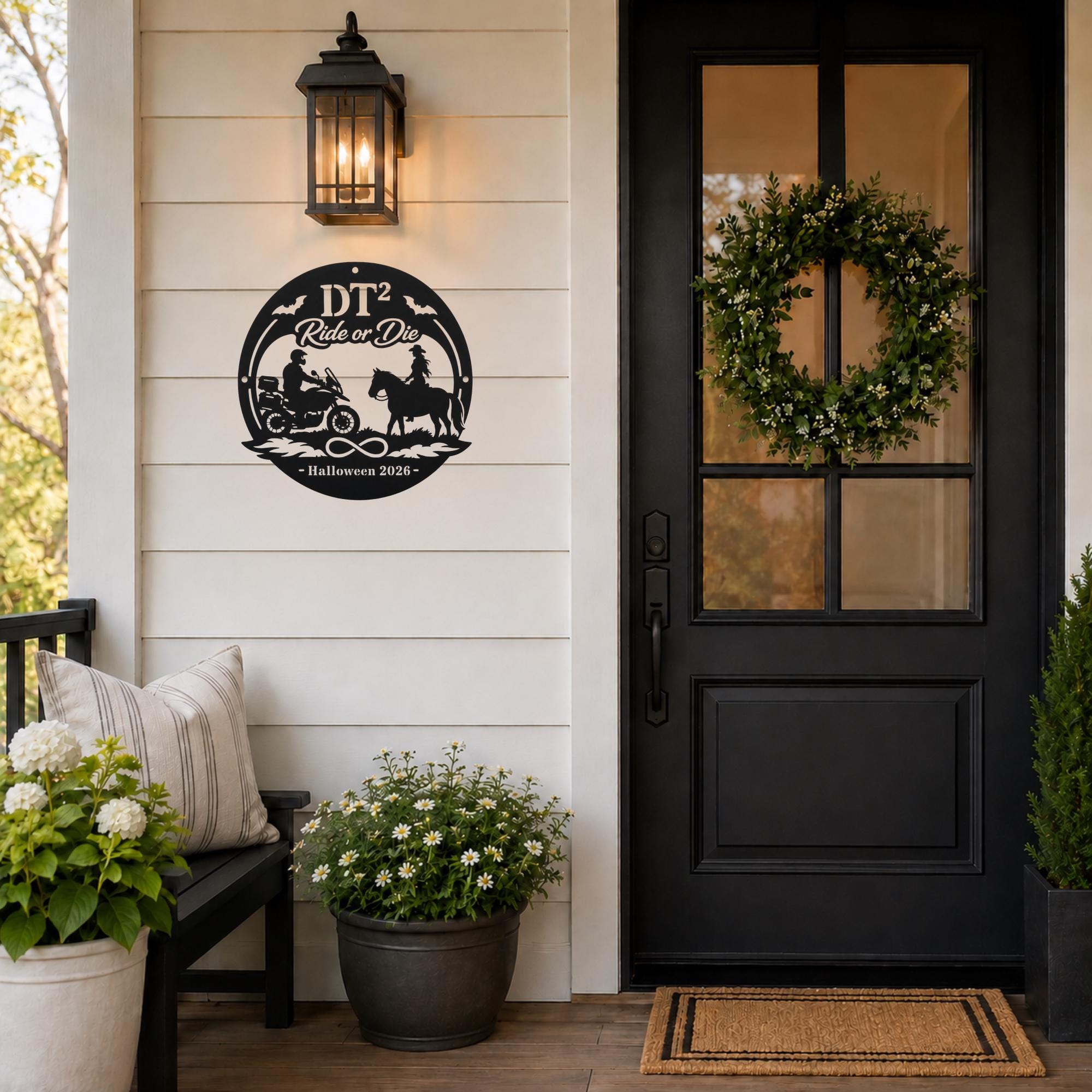 Personalized black “Ride or Die” Halloween metal sign with motorcycle rider, horseback rider, bats, infinity symbol, custom initials, and year displayed on a decorated front porch.