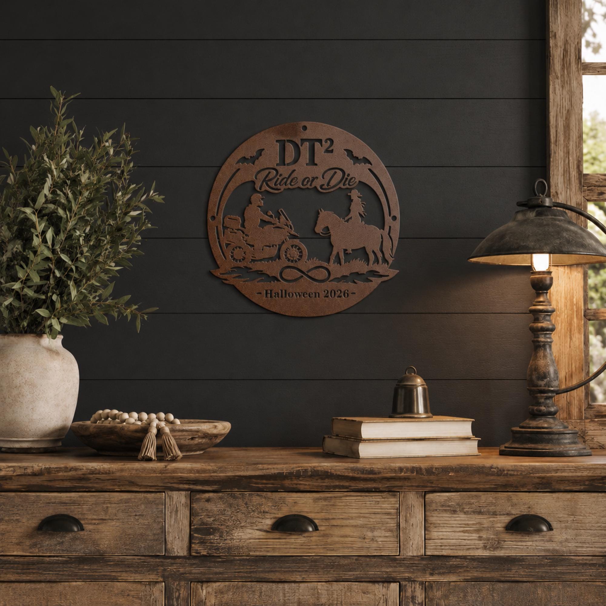 Personalized copper “Ride or Die” Halloween metal sign with motorcycle rider, horseback rider, bats, infinity symbol, custom initials, and year displayed on a decorated front porch.