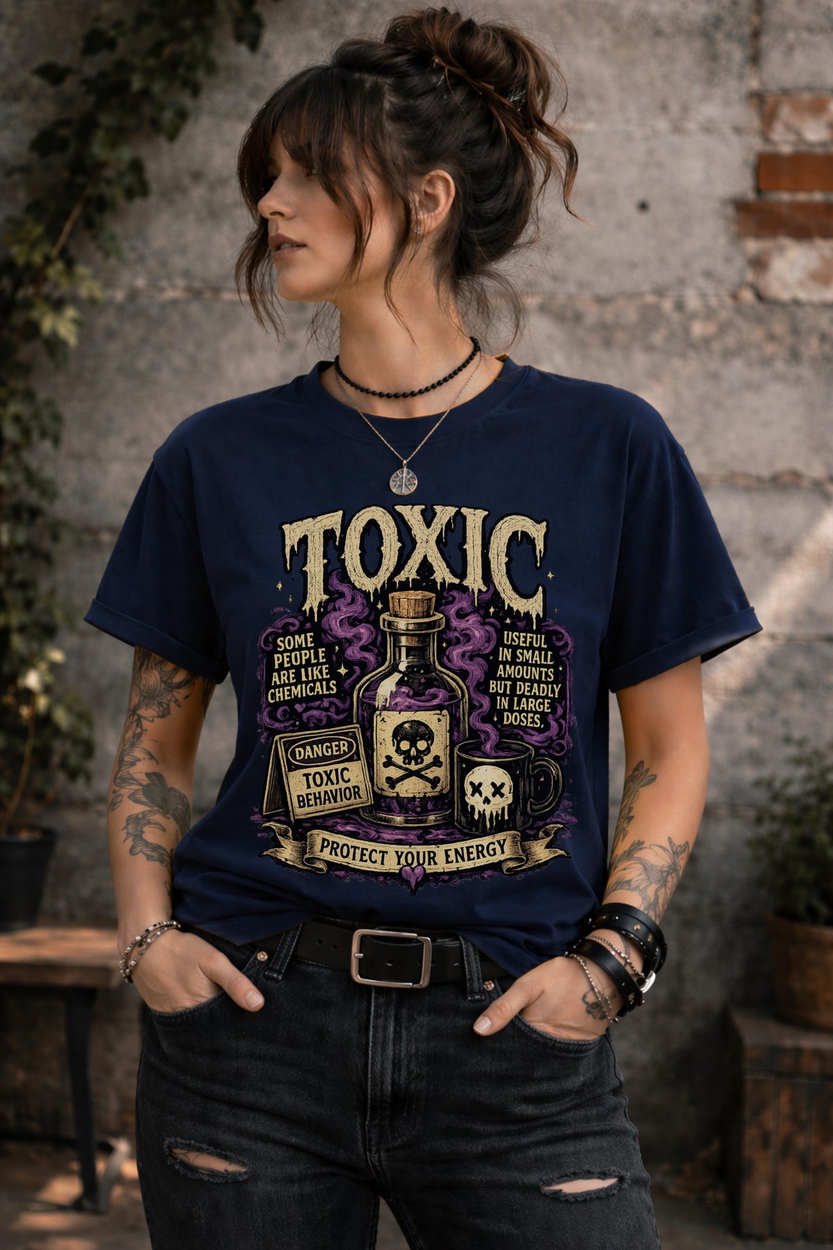 Female model wearing dark humor boundary-setting shirt with vintage toxic chemical bottle artwork