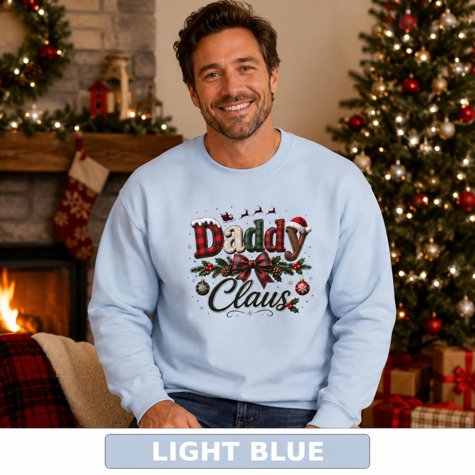 Daddy Claus sweatshirt with red and green plaid details, pinecones, hanging ornaments, holly, and holiday bow.