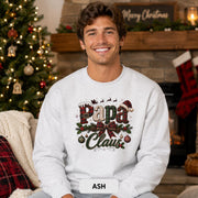 Papa Claus Christmas sweatshirt with buffalo plaid lettering, pinecones, holly, hanging ornaments, and festive bow.