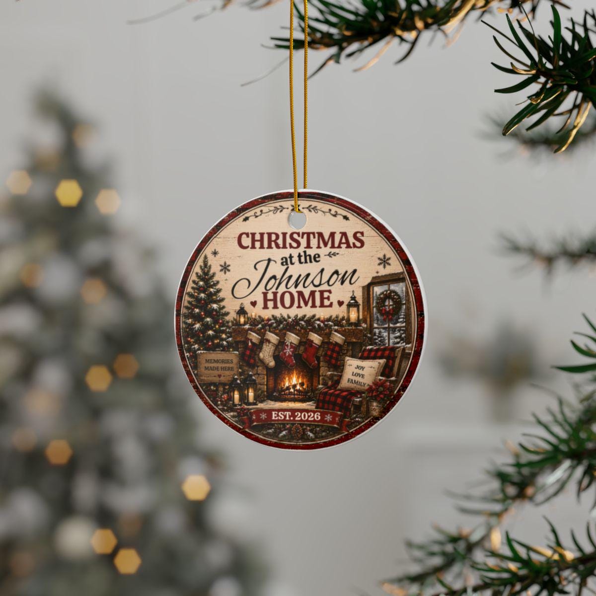 Round porcelain Christmas ornament personalized with family name and EST. year, displayed on a festive Christmas tree.