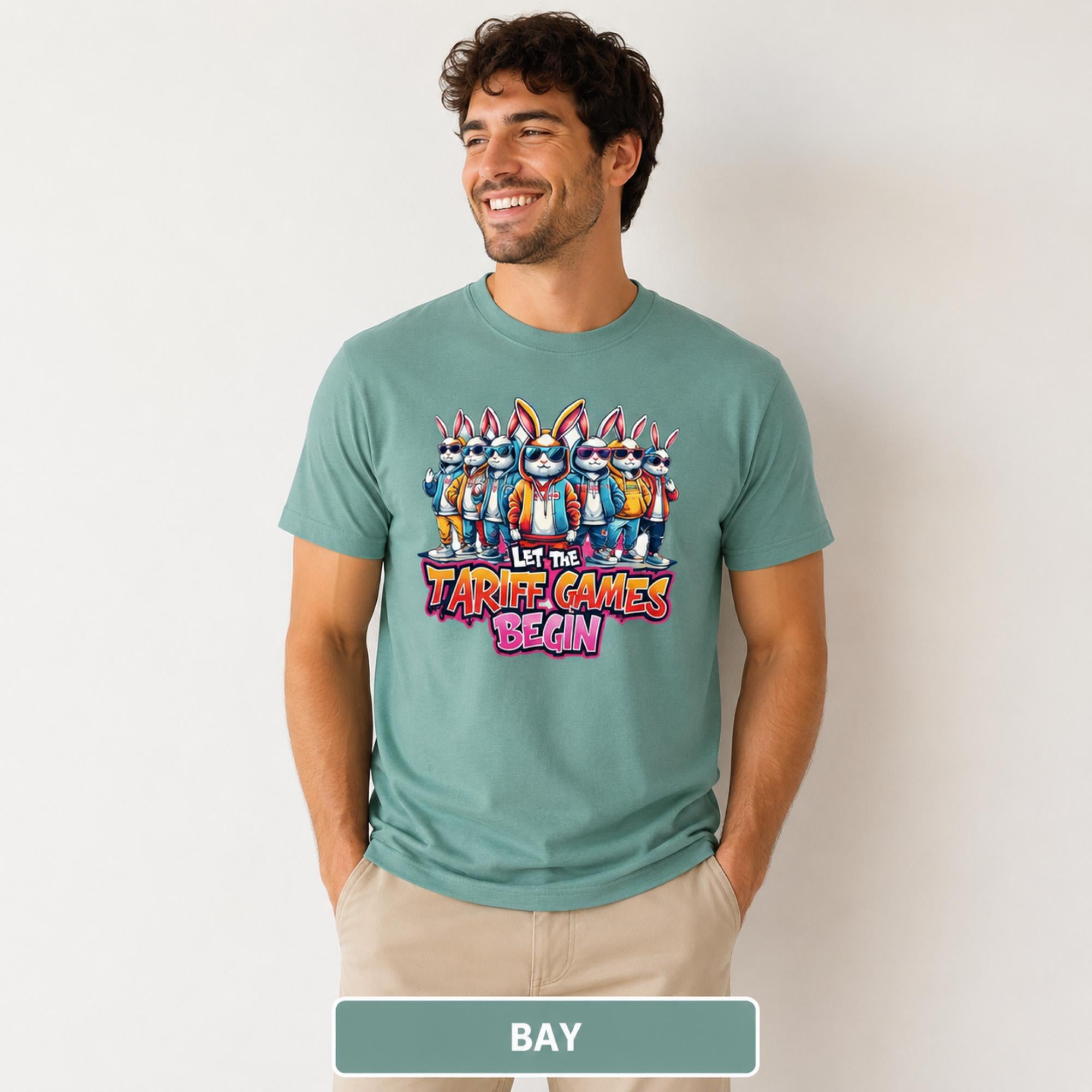 Male model wearing a bay T-shirt featuring stylish cartoon rabbits and bold “Let the Tariff Games Begin” text.