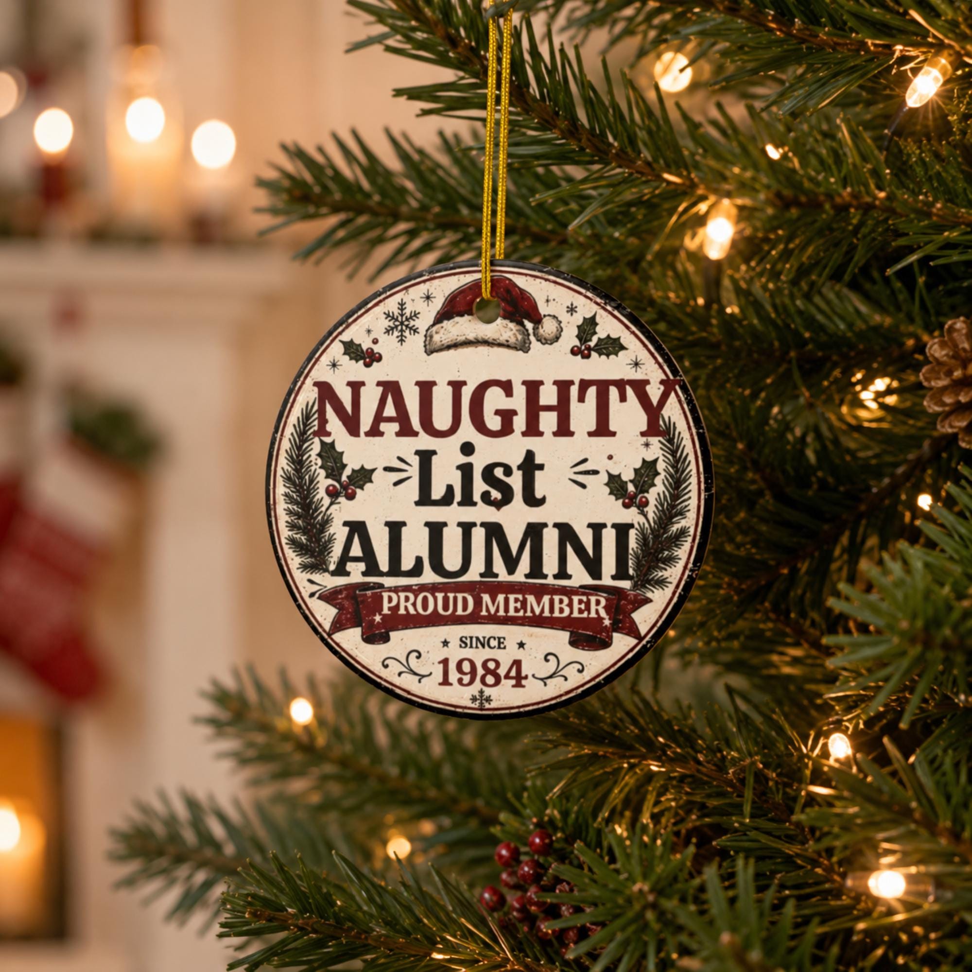 Naughty List Alumni ceramic Christmas ornament hanging on a decorated holiday tree with festive lights.