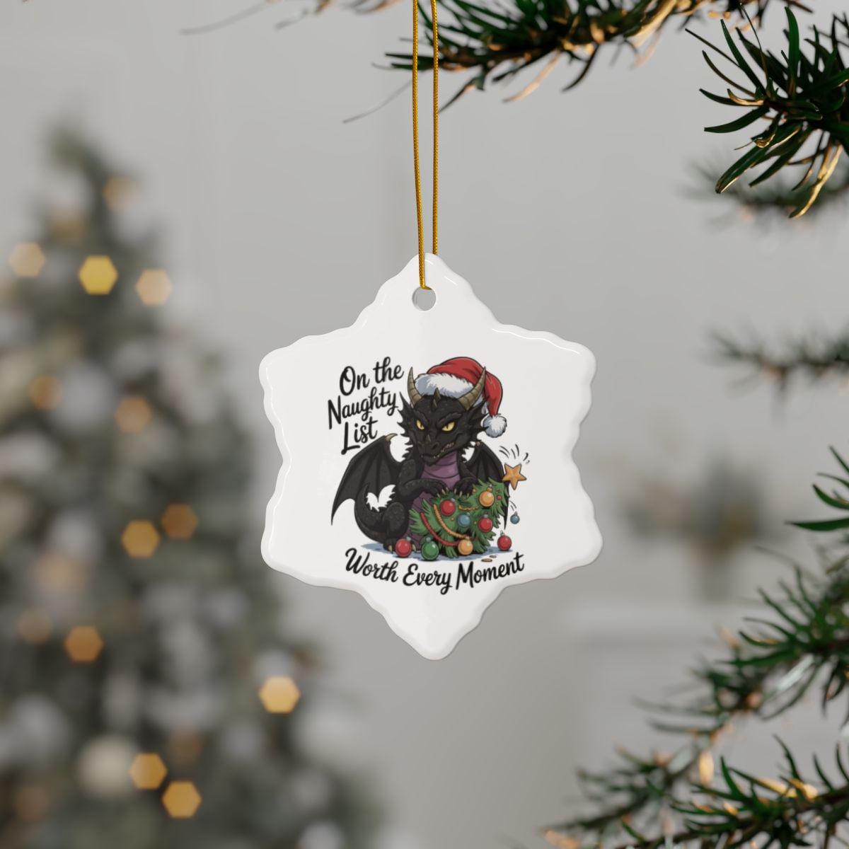 Snowflake ceramic ornament featuring a Santa hat dragon and Deck the Halls I Dare You holiday quote.