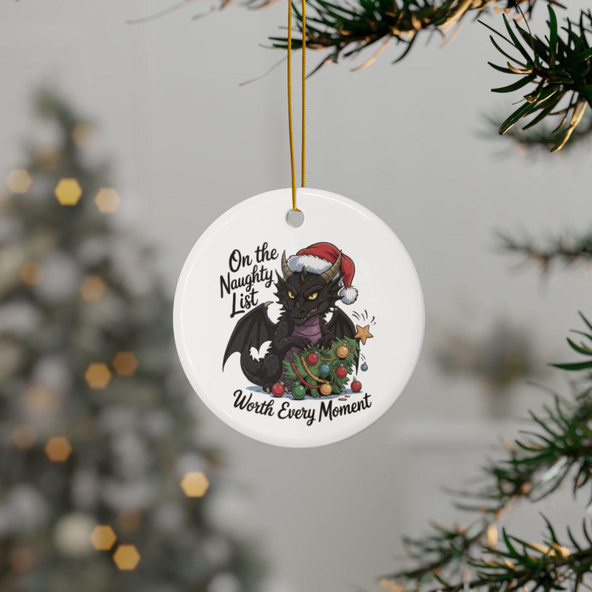 Round dragon ornament showing a decorated tree, colorful baubles, and playful Christmas artwork.