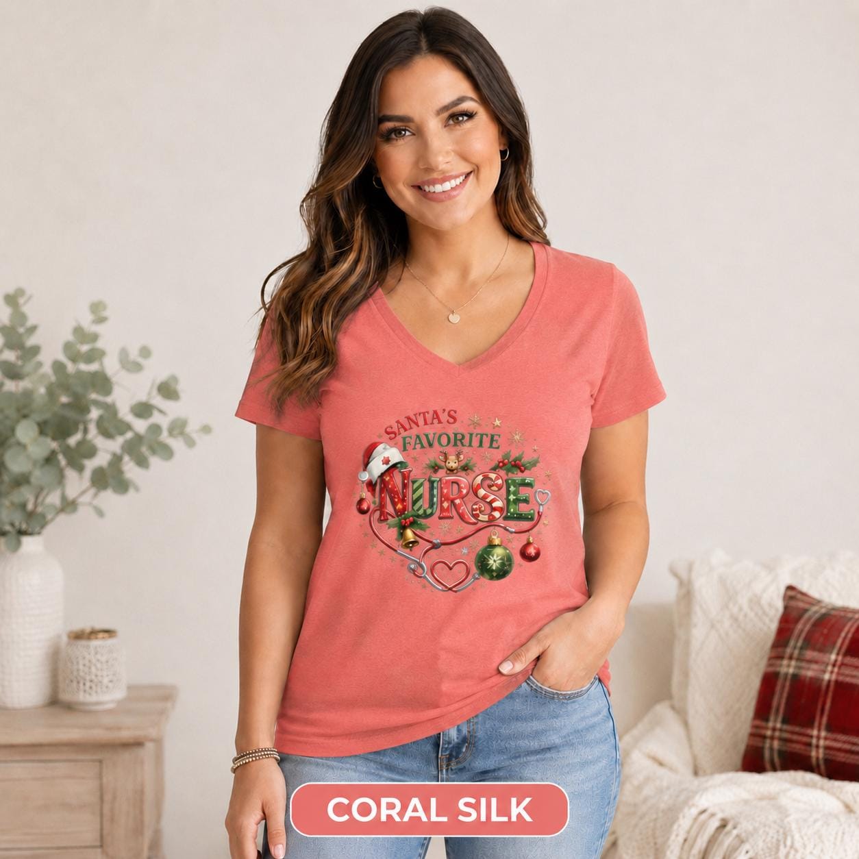 Medical worker Christmas apparel shown on a fitted coral silk V-neck shirt.