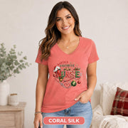 Medical worker Christmas apparel shown on a fitted coral silk V-neck shirt.