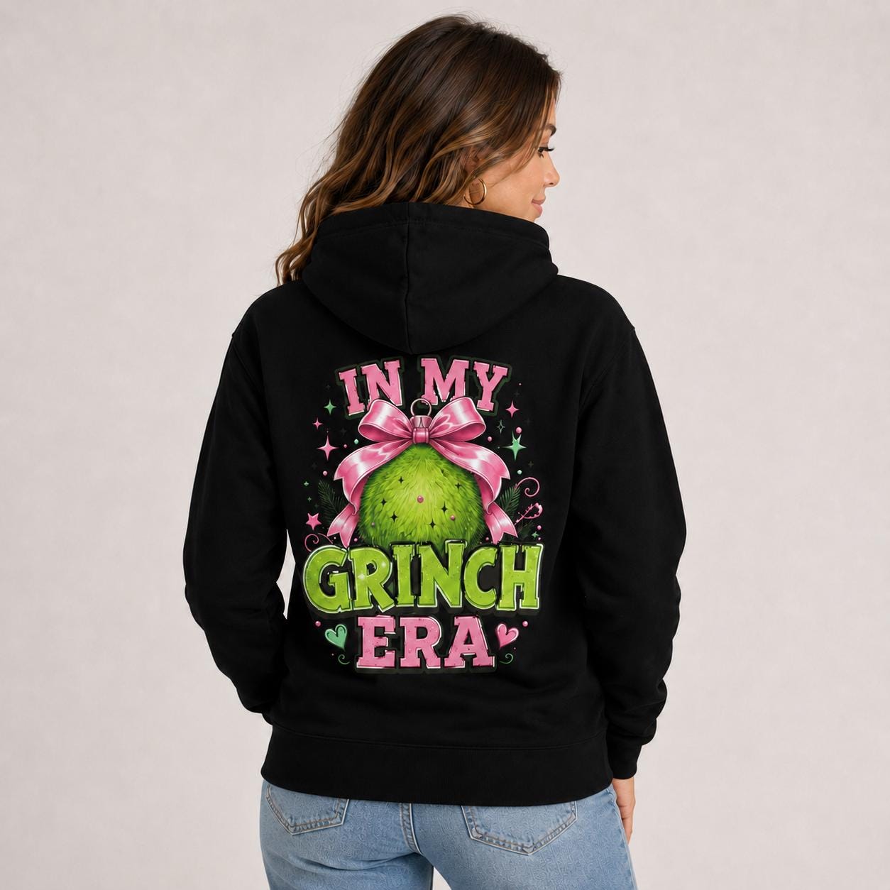 Cotton Heritage M2580 hoodie featuring a pink and green holiday character design with In My Grinch Era text on the front.