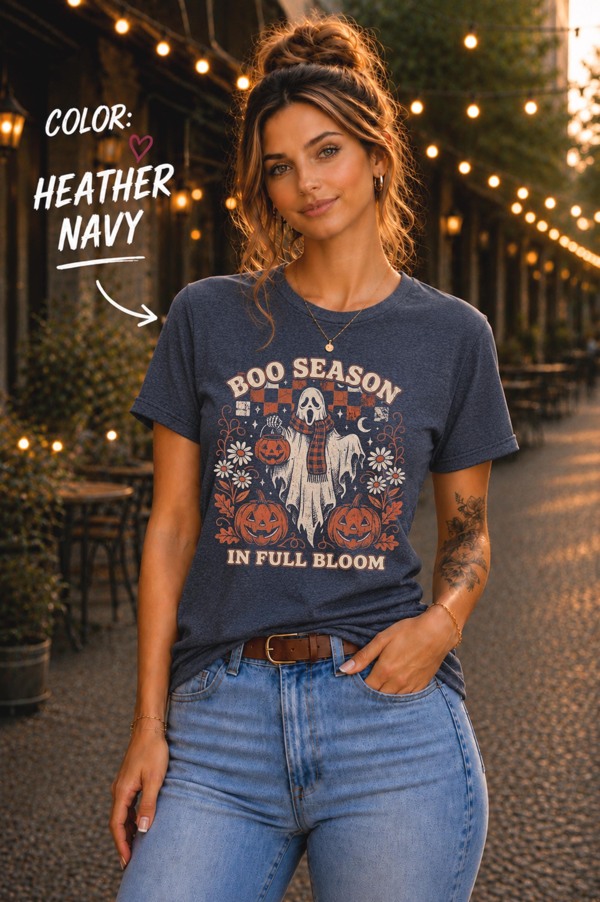 Vintage Halloween shirt featuring Boo Season in Full Bloom lettering, pumpkins, flowers, bats, and checkerboard details.